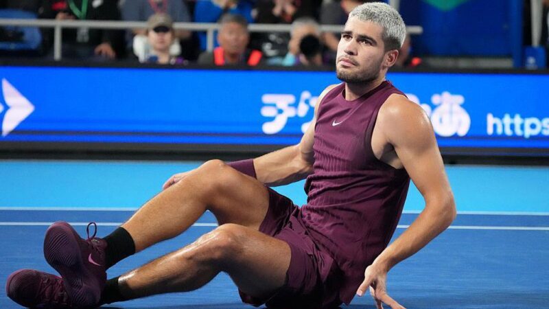Carlos Alcaraz overcomes dramatic fall to advance in Tokyo